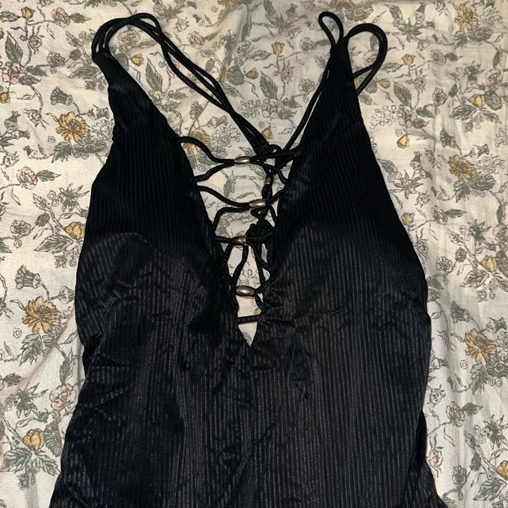 NWOT black one piece with cut out low-v